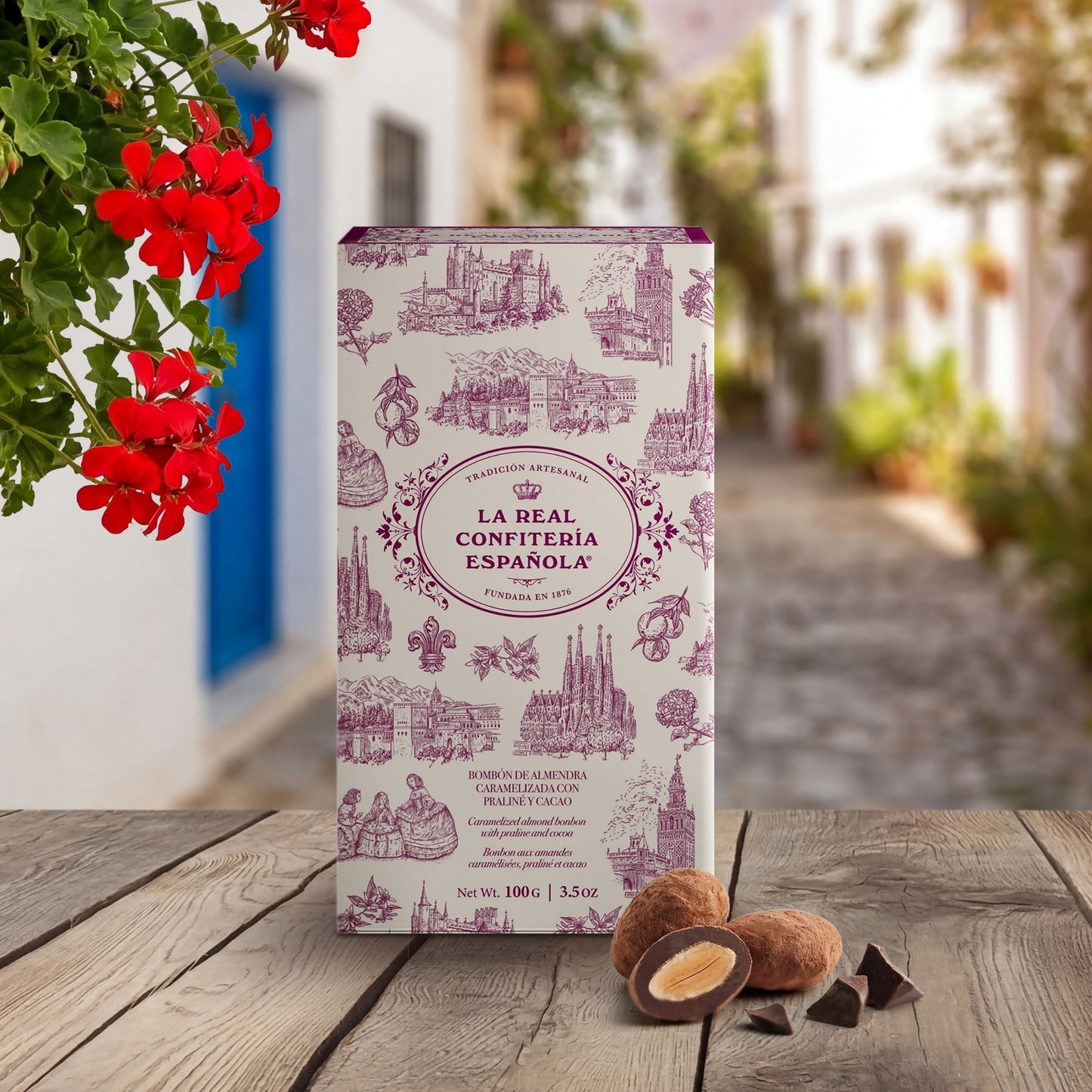 Caja Hispania. Bombones de almendra caramelizada cubierta de chocolate blanco y cacao.